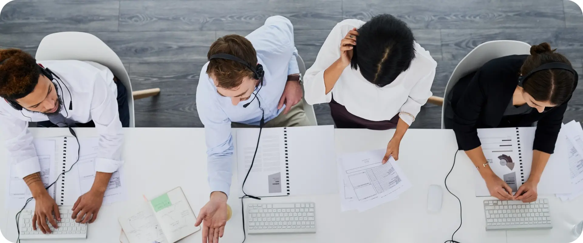 A group of service technicians collaborate on solving a problem