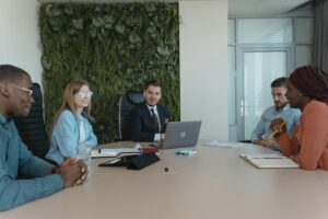 This is an image of students talking with each other in a college campus