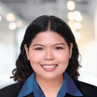 Professional woman smiling in business attire at Canyon GBS office.