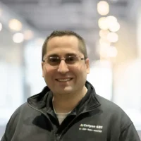 Professional Canyon GBS team member smiling at work.