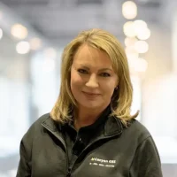 Friendly Canyon GBS customer service representative in professional attire.