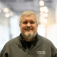 Friendly Canyon GBS team member smiling in professional attire.