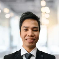 Portrait of a professional man in formal attire at Canyon GBS office.